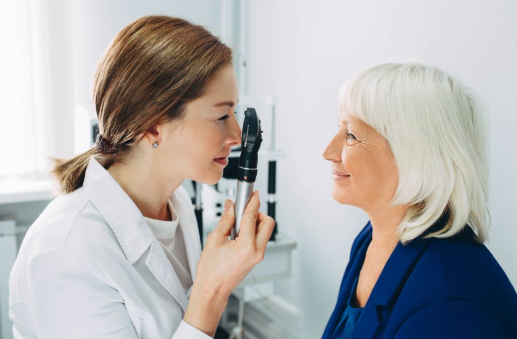 A female optometrist examining a female patient's eyes