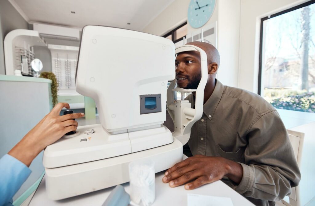An adult patient gets comprehensive testing done during a contact lens exam to make sure their contacts are the right fit.