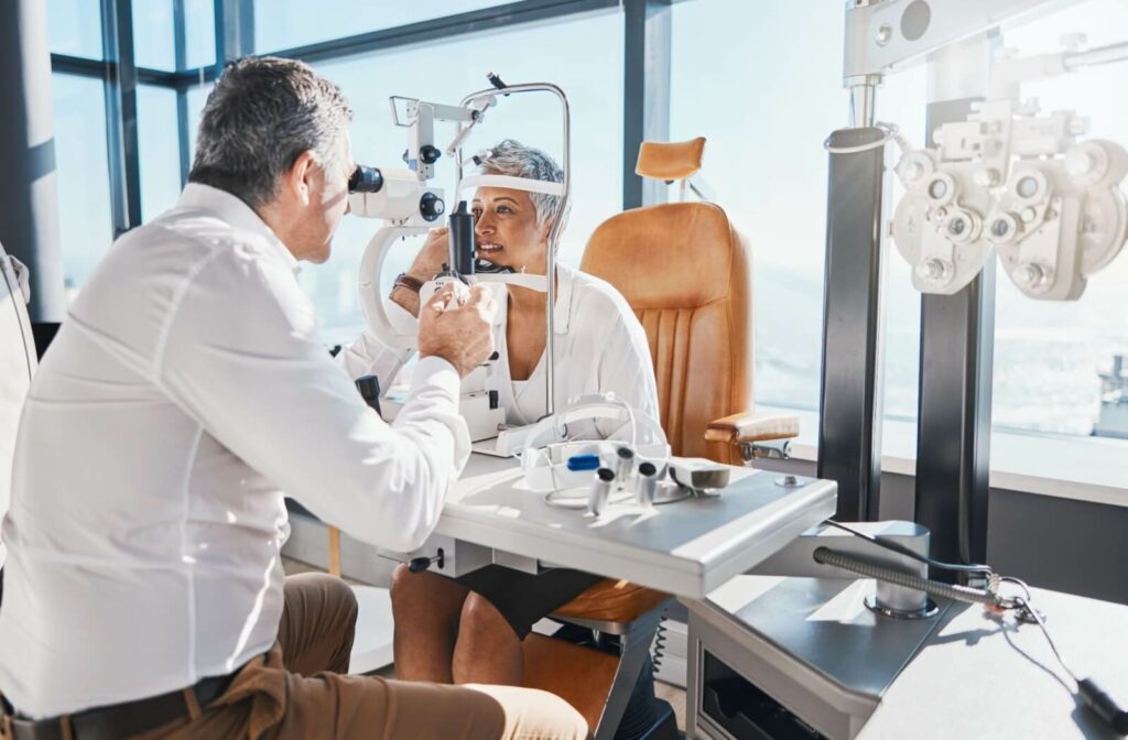 Optometrist examining patient’s eyes